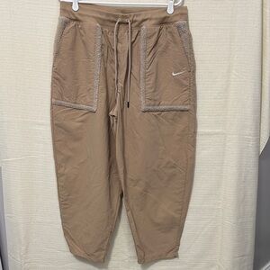 Nike High Wasted Jogger Pants with Sherpa lined pockets and trim.